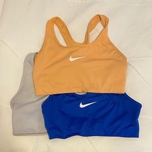 3 nike sports bras! Blue orange white size medium